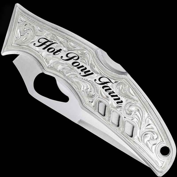 "Our Buffalo Plains Custom Knife is the perfect blend of rugged charm and masterful craftsmanship. Crafted using a SpyderCo Byrd knife and a German Silver plate, this custom knife features intricate hand-engraved details and hand-painted lettering as
